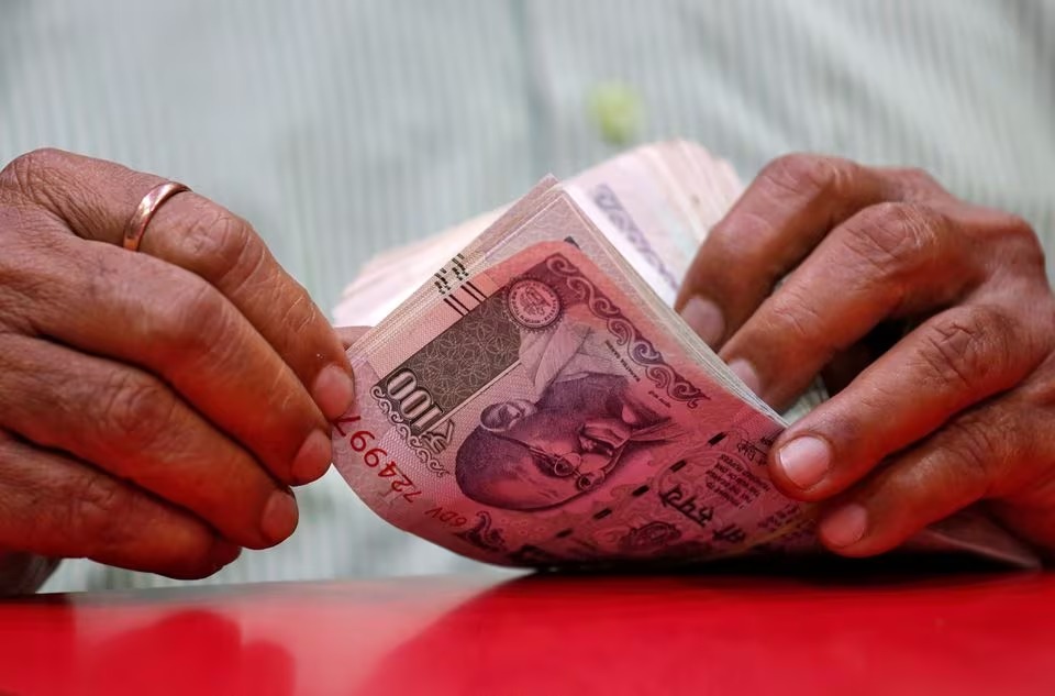 Rupee drops, pressured by weaker Asian peers in data-heavy week